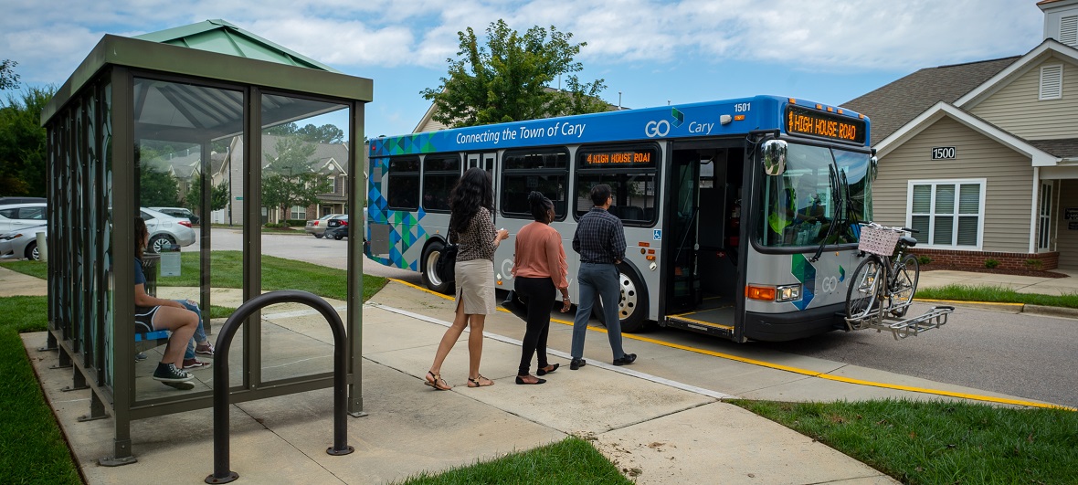 Passengers boarding a Go Cary bus