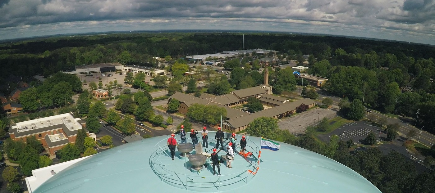 Town staff on top of water tank