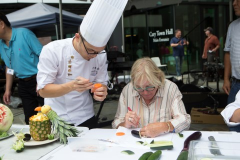 Chef carving fruit at Lazy Daze