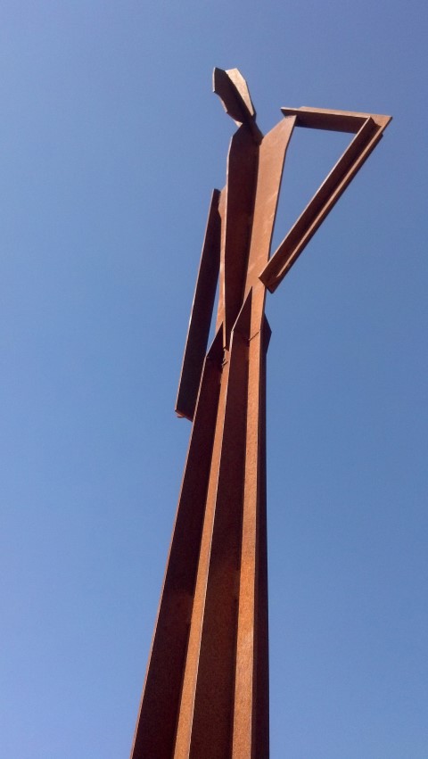 visitor sculpture with sky