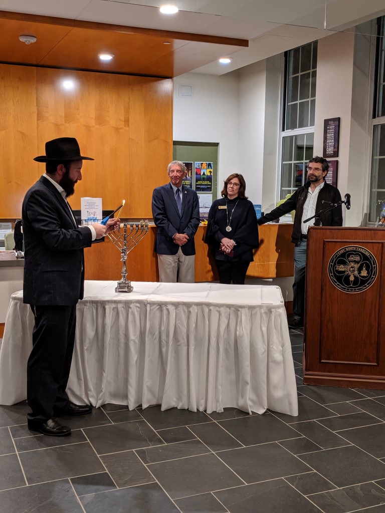 Town officials observing Menorah Lighting