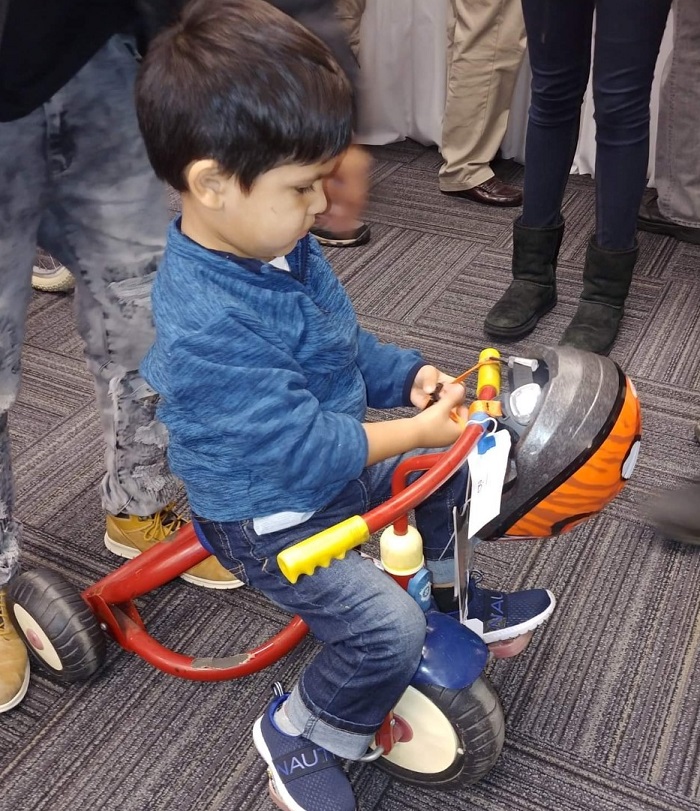 Child on tricycle