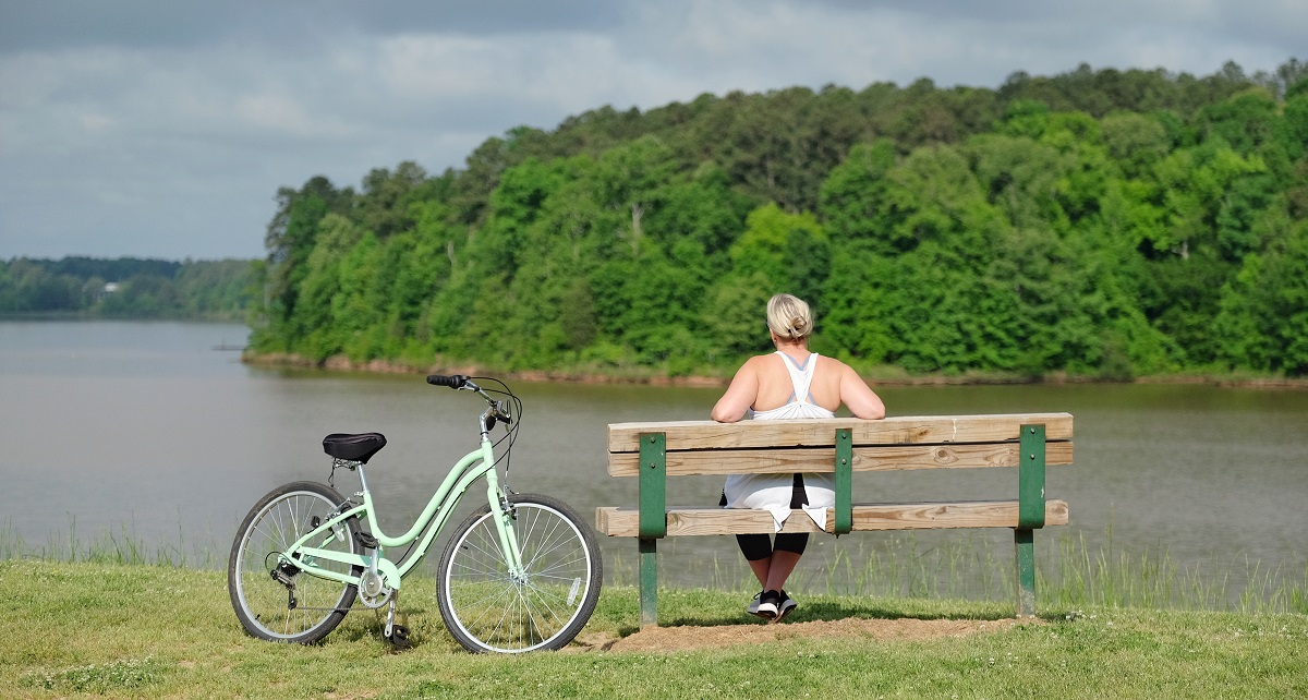 Woman on bench looking at water