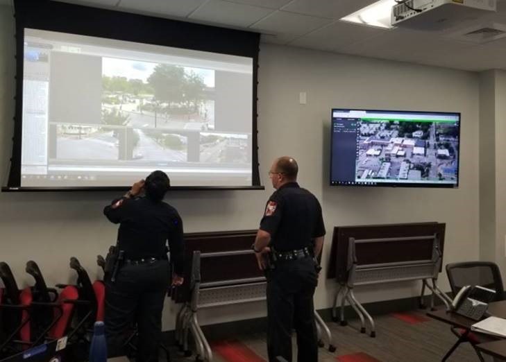 Police Officers viewing a screen in the Emergency Operations Center