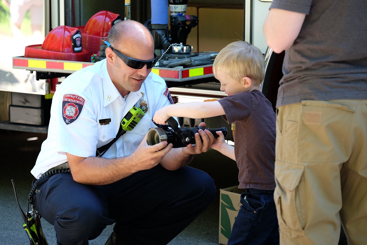 Firefighter talking to a child