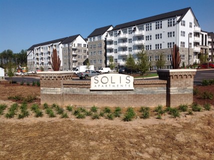 Edwin White_ entry features on wall at SOLIS Apartments