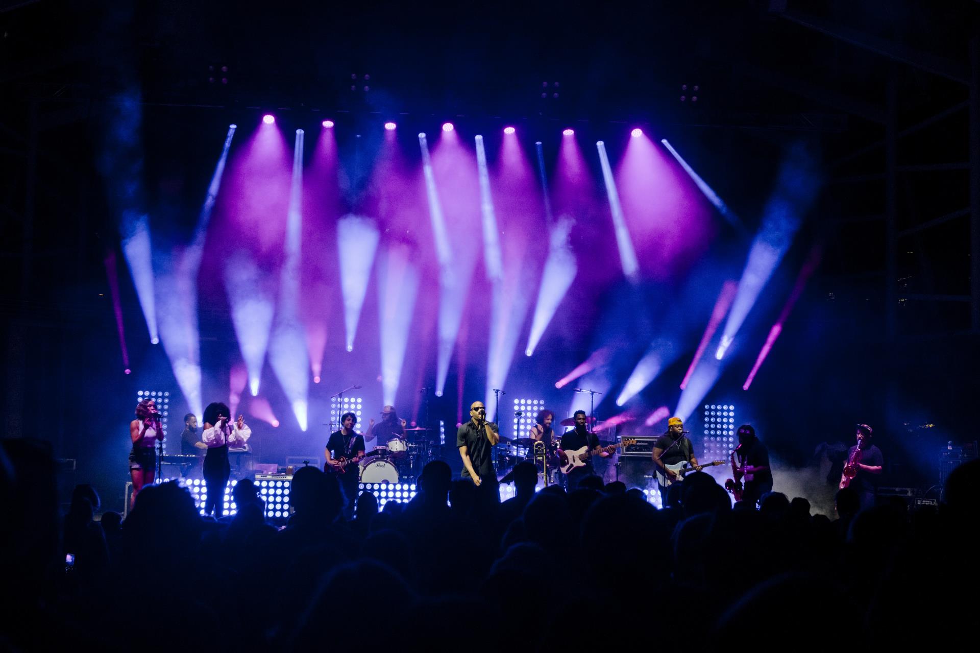 Koka Booth stage at night with performers