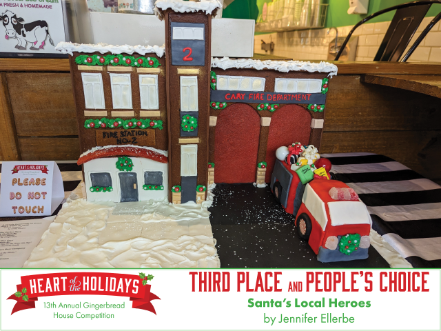 Third place overall winner and People's Choice winner. Santa's Local Heroes by Jennifer Ellerbe is a model of Cary's Fire Station 2 and includes a firetruck filled with presents.