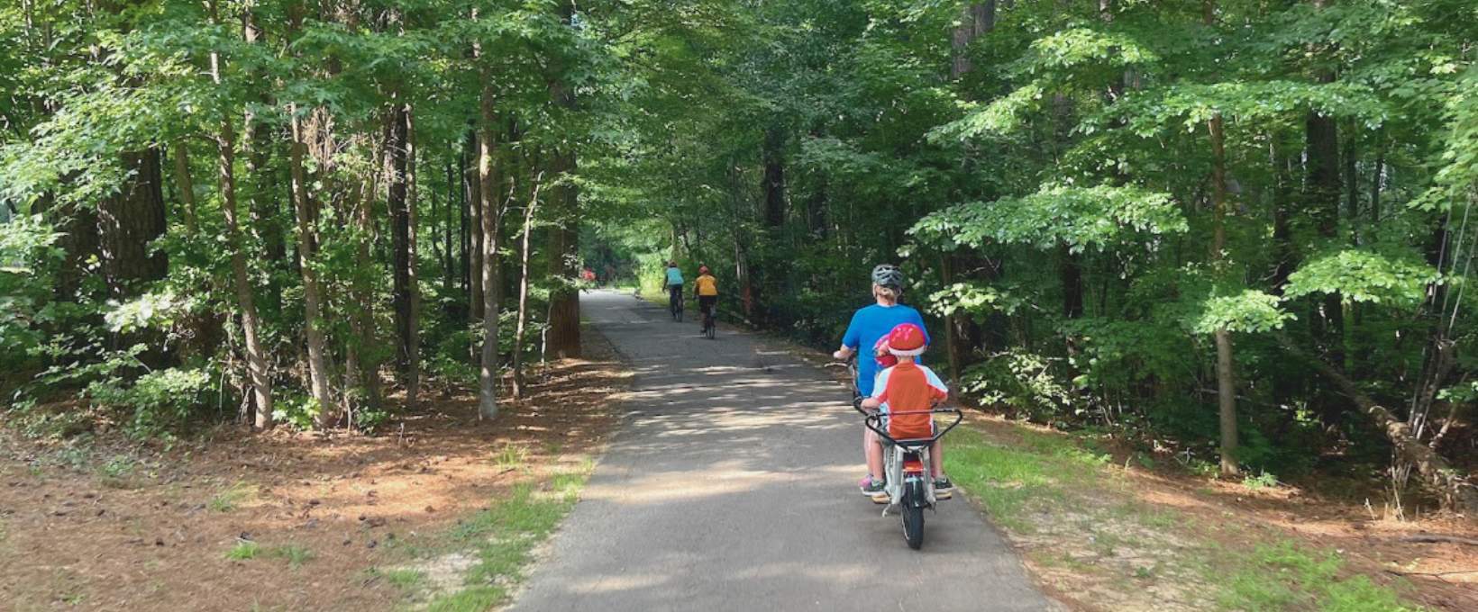 Mom Biking with 2 Kids on Board