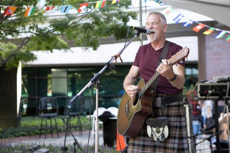 Musician Trip Rogers performing on stage at Lazy Daze 2024