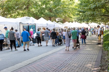 Artist booths line the road at Lazy Daze 2024