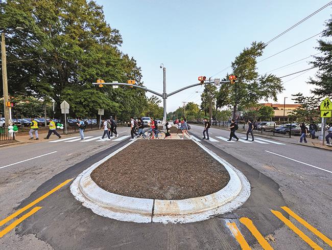 Pedestrians crossing along crosswalk