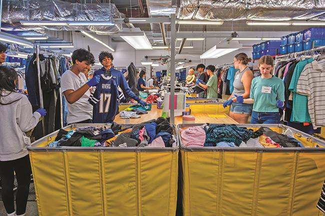 High school students sorting donations at Dorcas