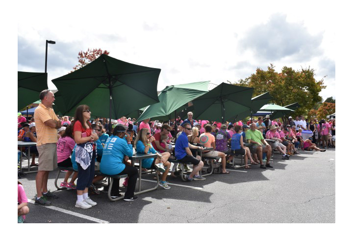 Attendees at picnic tables